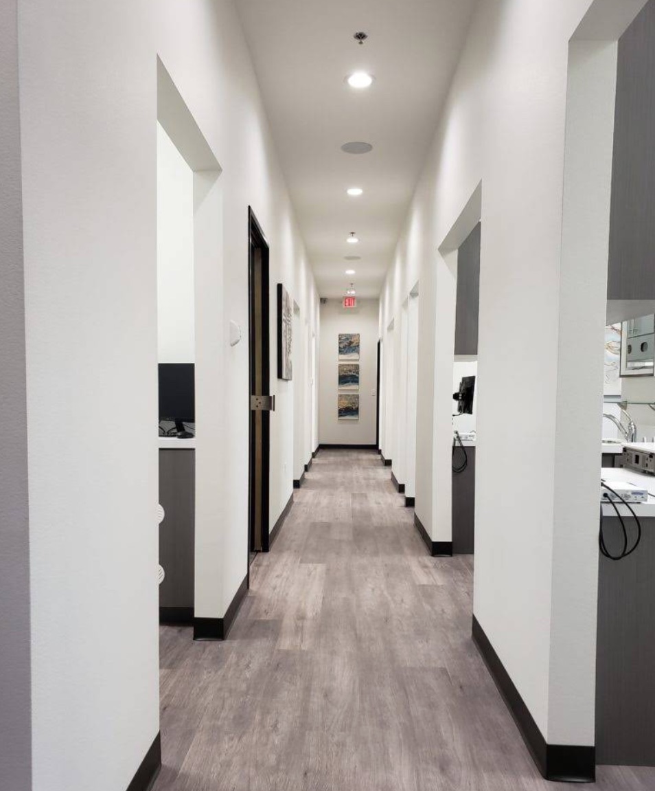 The hallway connecting treatment rooms at Floss City Dental in Plano, TX