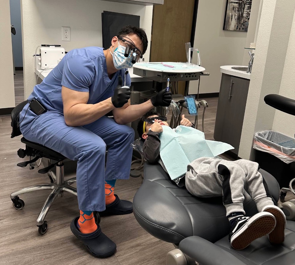 Dr. Kevin Chuang providing pediatric dental care in Plano, TX