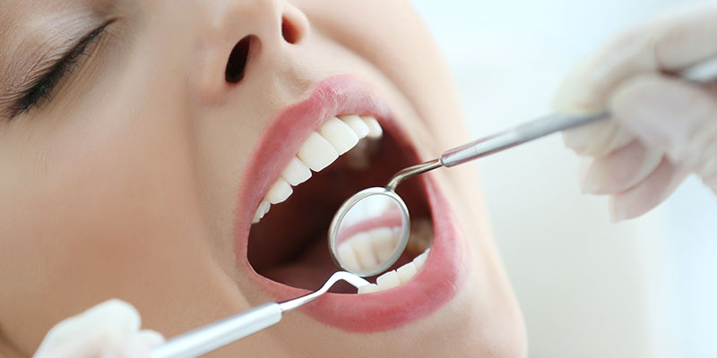 woman-receiving-comprehensive-dental-exam