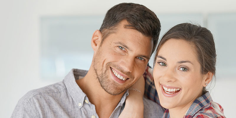 young-couple-showing-bright-smiles